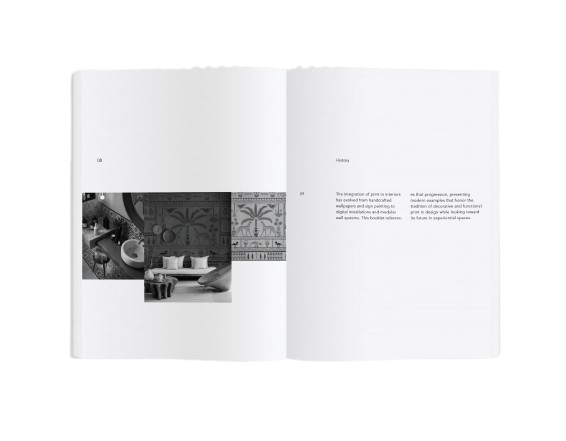 Open booklet spread titled History, with black and white interior photographs and a wallpaper of palm trees on the left page and two columns of text on the right