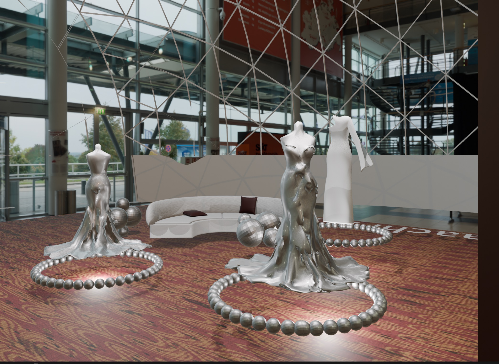 Three mannequins in sculpted silver and white gowns, each ringed by a necklace of mirrored beads, in front of a curved sofa